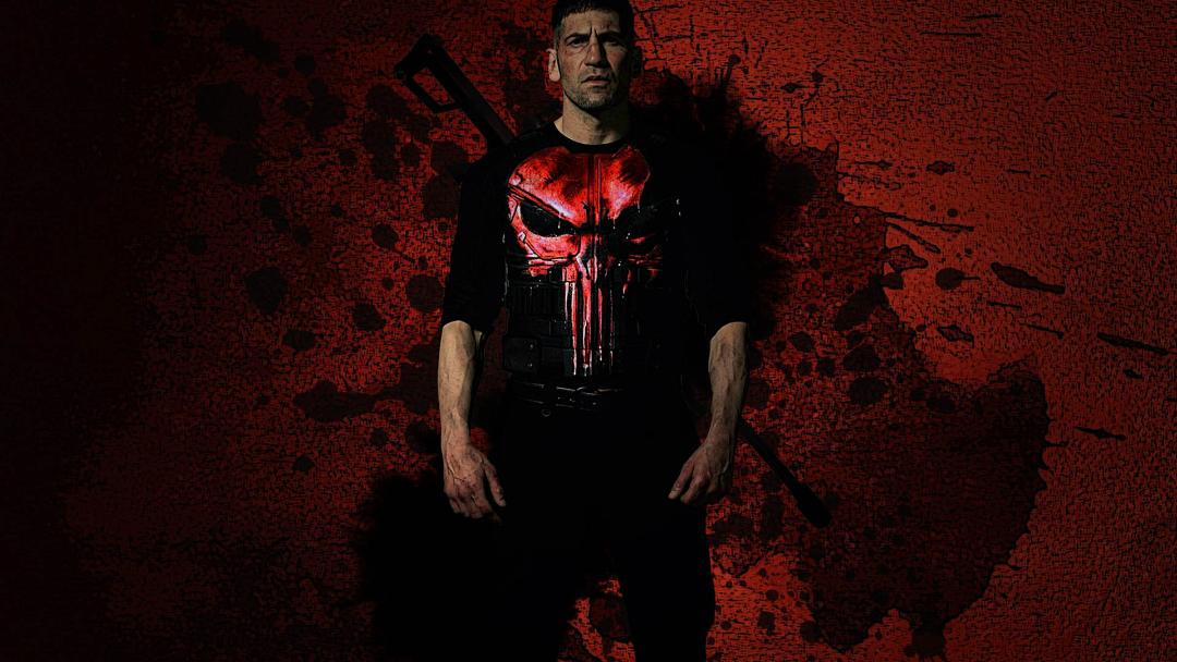 شخصیت فرانک کسل با بازی جان برنتال با پس زمینه قرمز رنگ کاور سریال punisher
