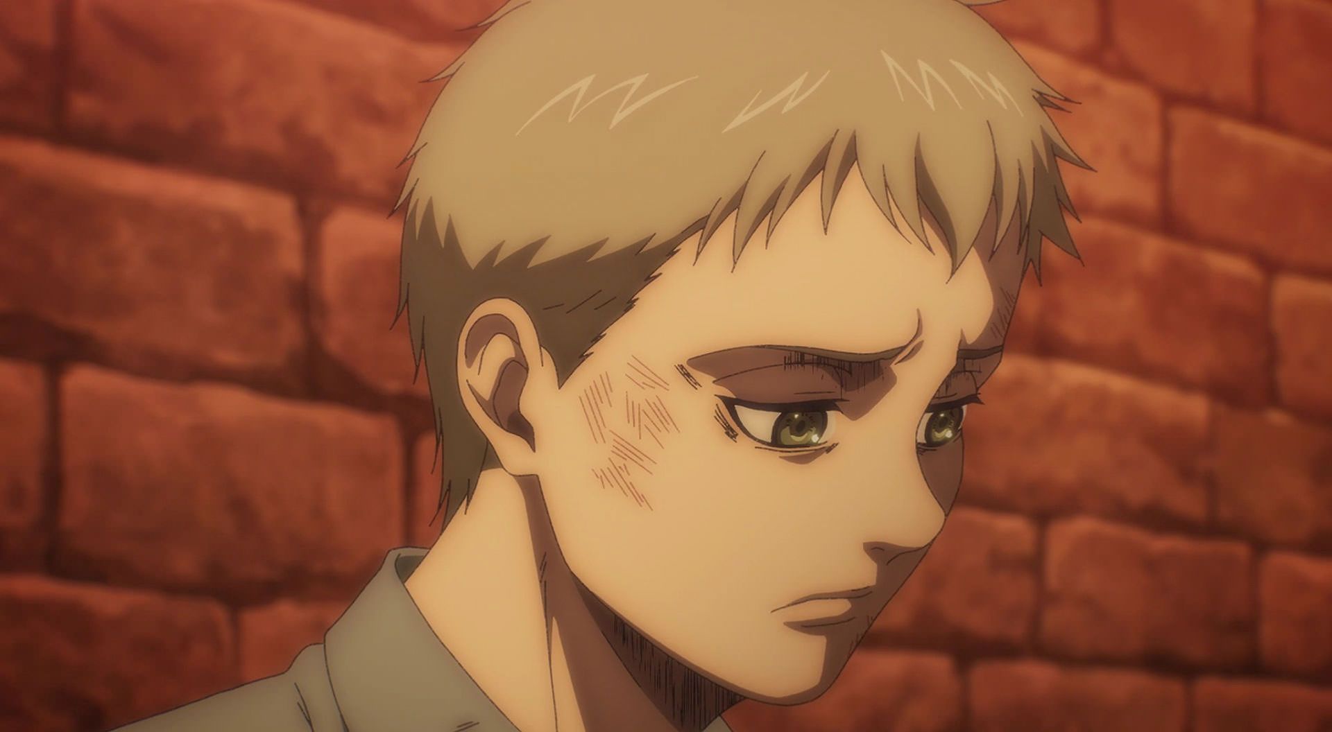 پسر غمگین تکیه داده به دیوار با صورت نسبتا کبود در فصل آخر انیمه Attack on Titan