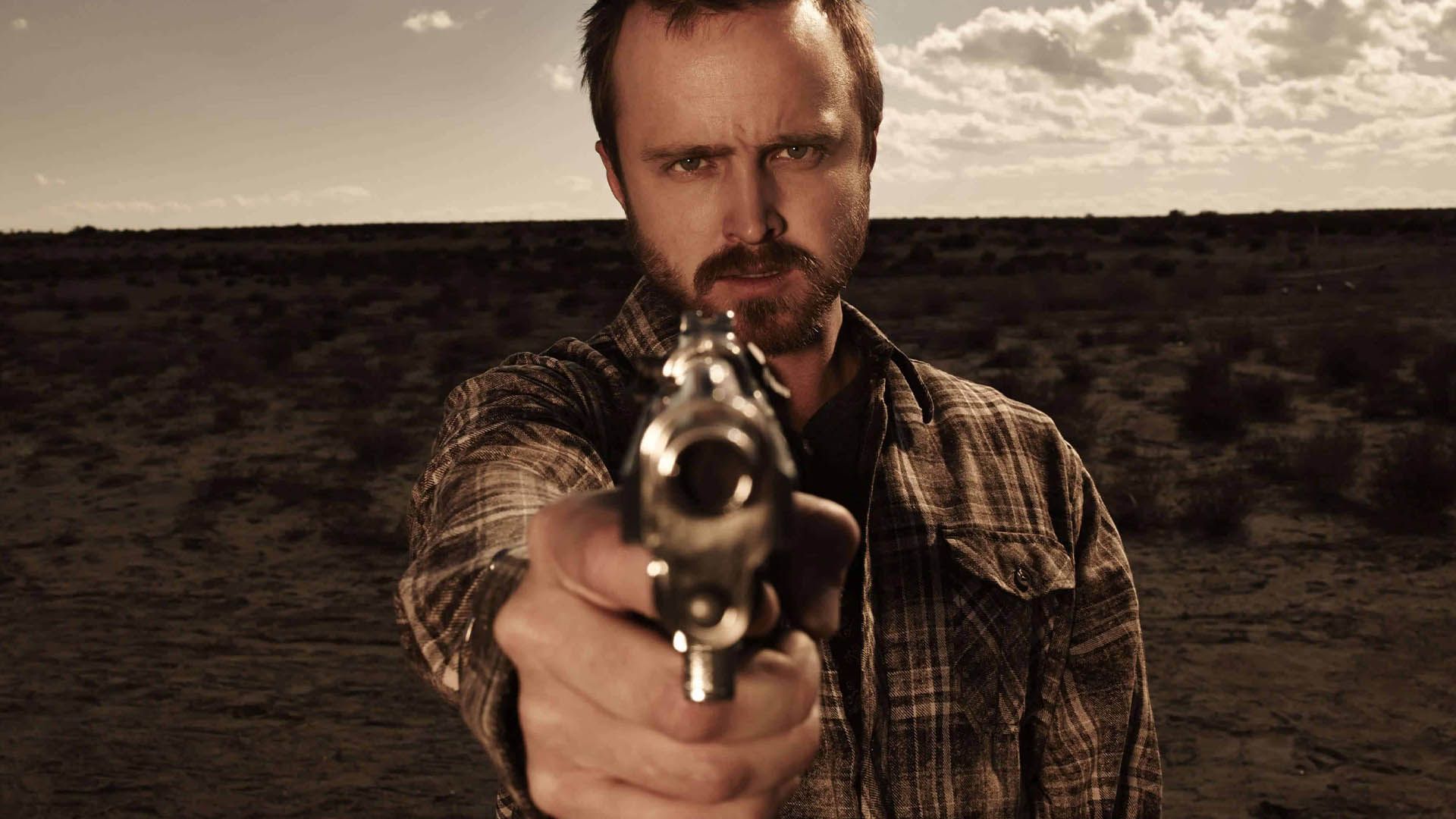 2021-3-aaron-paul-aiming-gun