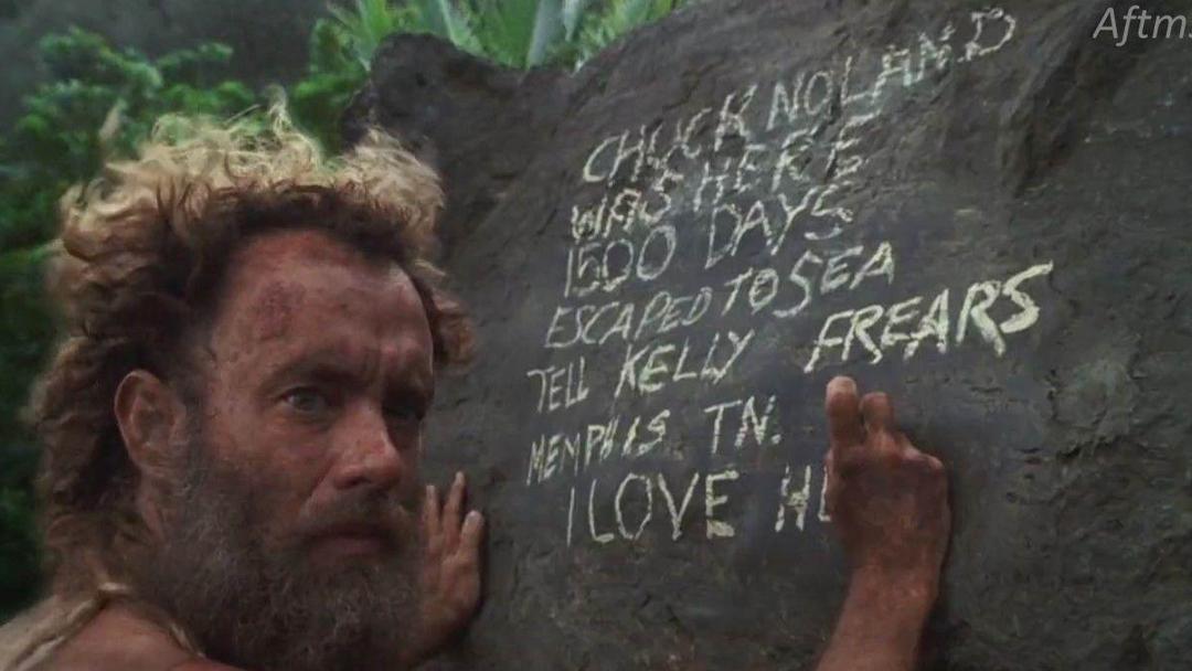 تام هنکس درحال نوشتن روی سنگ در فیلم Cast Away