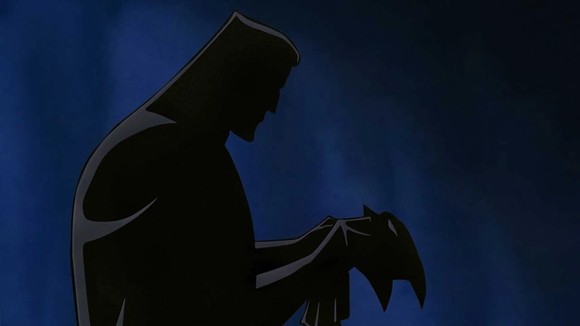 نقاب در دستان بتمن در انیمیشن Batman: Mask of the Phantasm، یکی از برترین فیلم های ابرقهرمانی تاریخ سینما