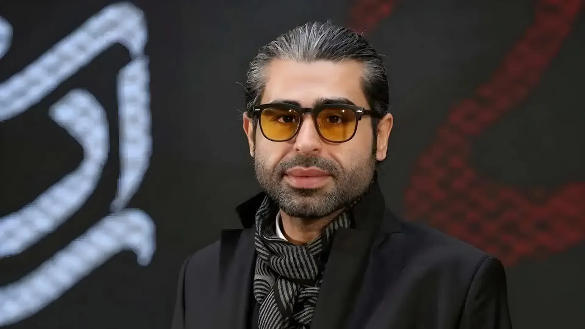 چهره امیر نوری (Amir Nouri) با عینک آفتابی زرد رنگ