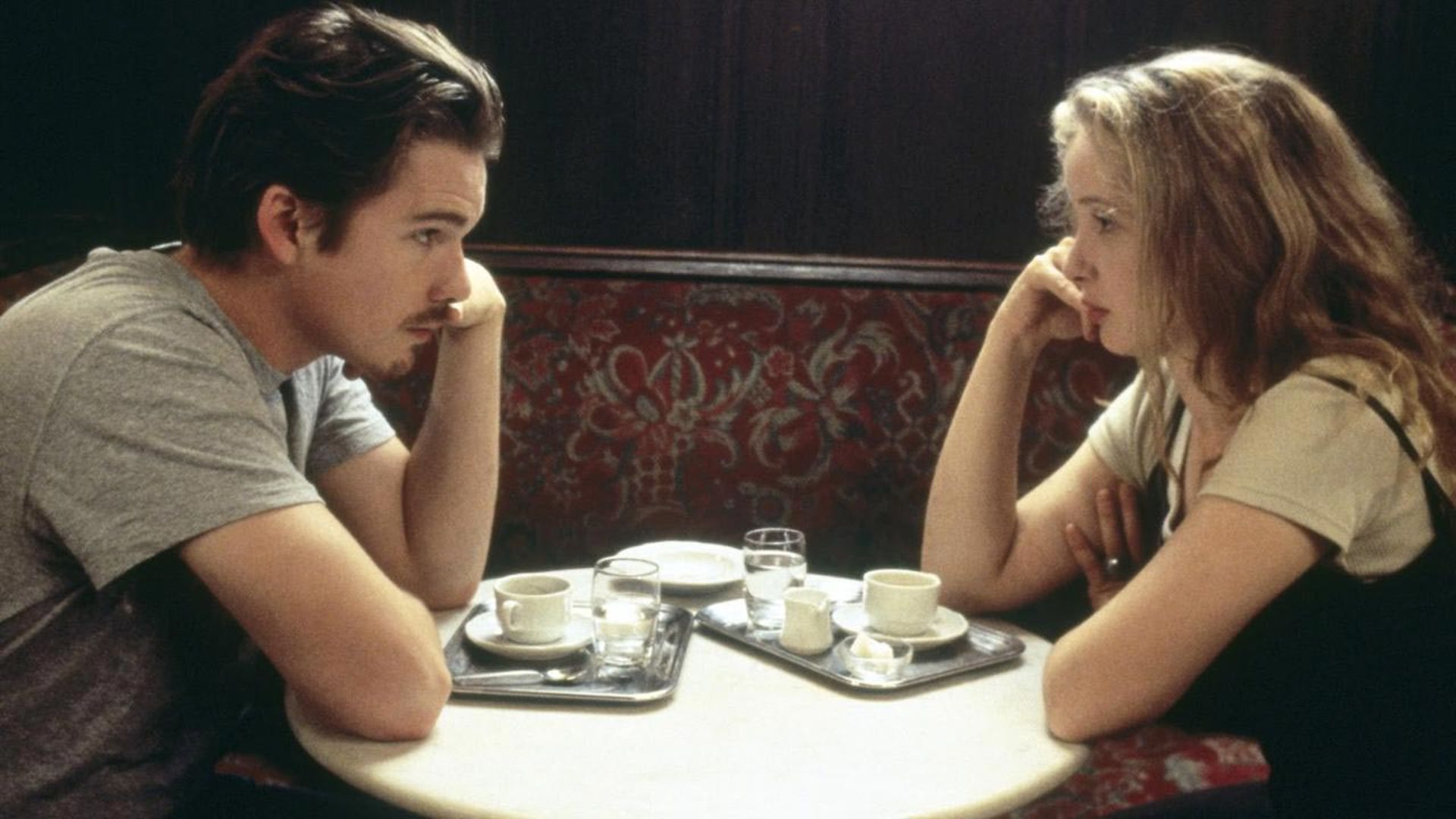 Before_Sunrise_young_man_woman_sit_in_front_each_other