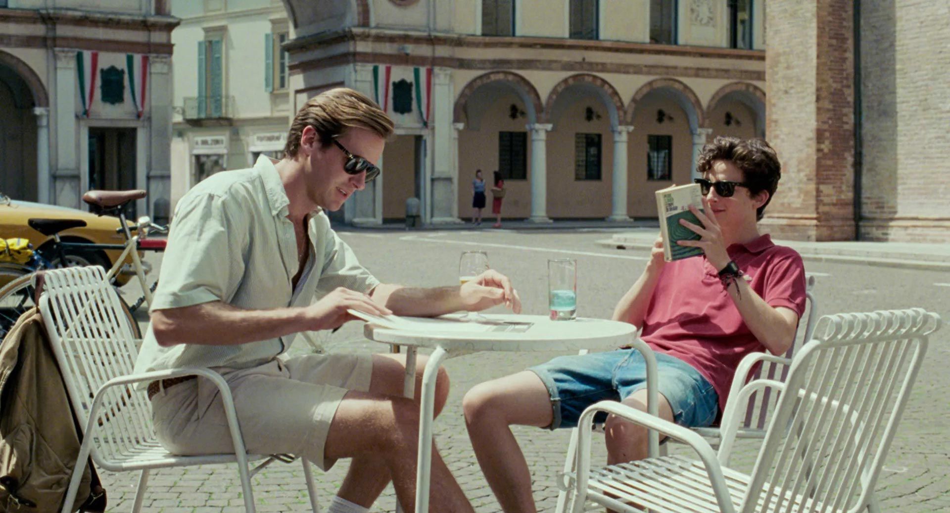 Call_Me_By_Your_Name_two_young_man_sitting_around-a_table