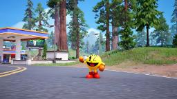 شخصیت پک‌من (Pac-Man) در محیط جنگلی و جاده‌ای بازی فورتنایت