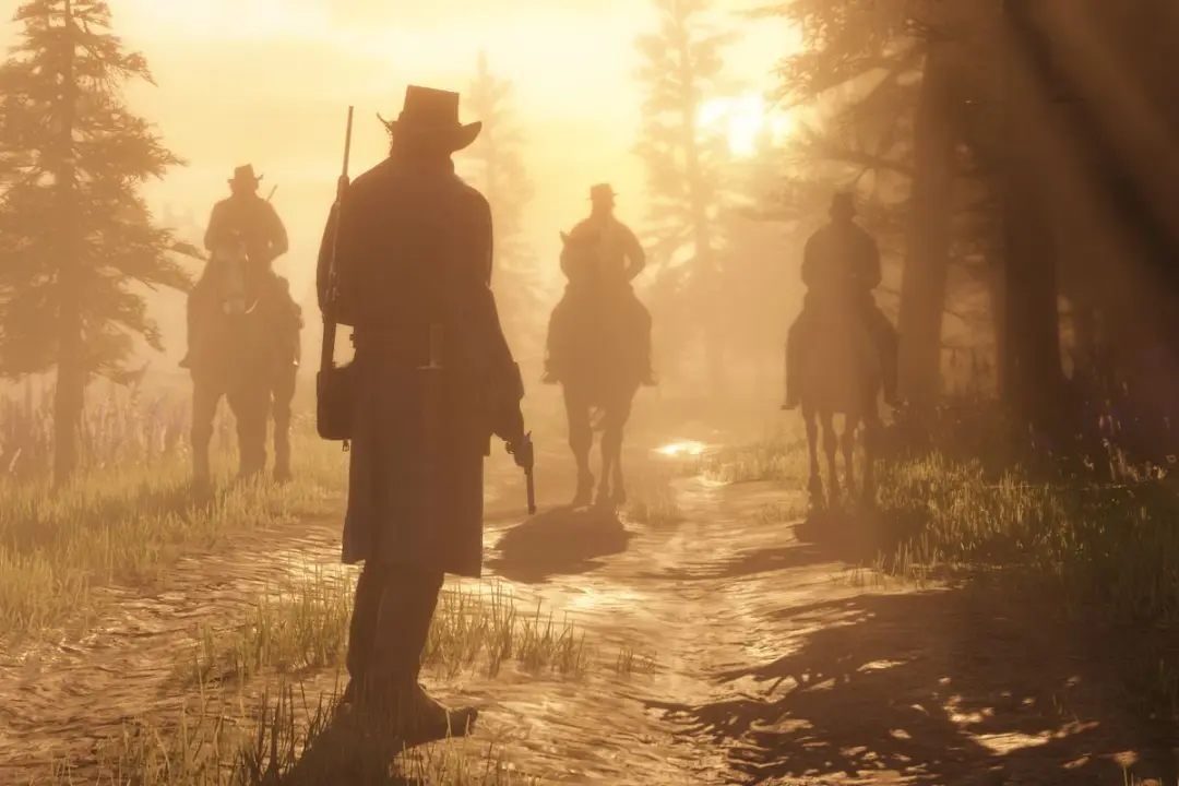 گروهی از شخصیت‌ها در بازی رد دد ردمپشن ۲ (Red Dead Redemption 2) در حال حرکت در مسیر جنگلی