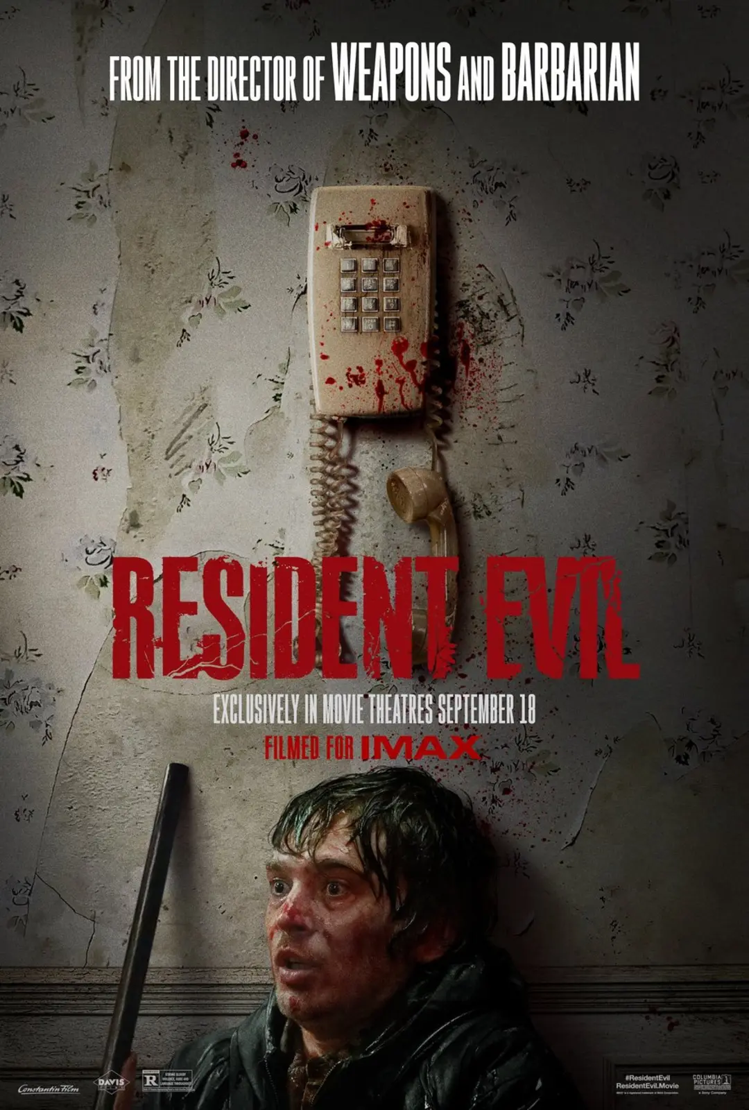 پوستر فیلم رزیدنت ایول (Resident Evil) با تصویر مردی و تلفن خون‌آلود